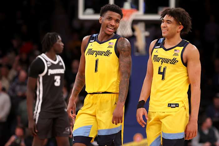 Mar 15, 2024; New York City, NY, USA; Marquette Golden Eagles guards Kam Jones (1) and Stevie Mitchell (4) react during the second half against the Providence Friars at Madison Square Garden.